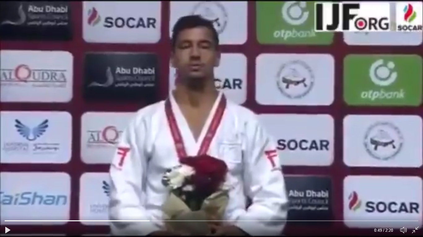Tal Flicker sings Israeli national anthem after receiving gold medal in Abu Dhabi