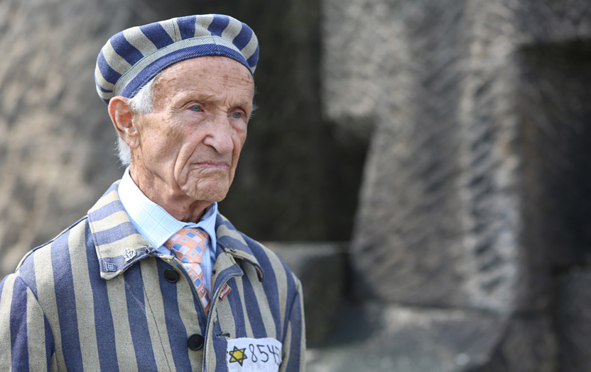 Ed Mosberg, concentration camp survivor wearing camp inmate uniform