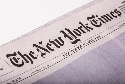 New York Times logo on newspaper cover