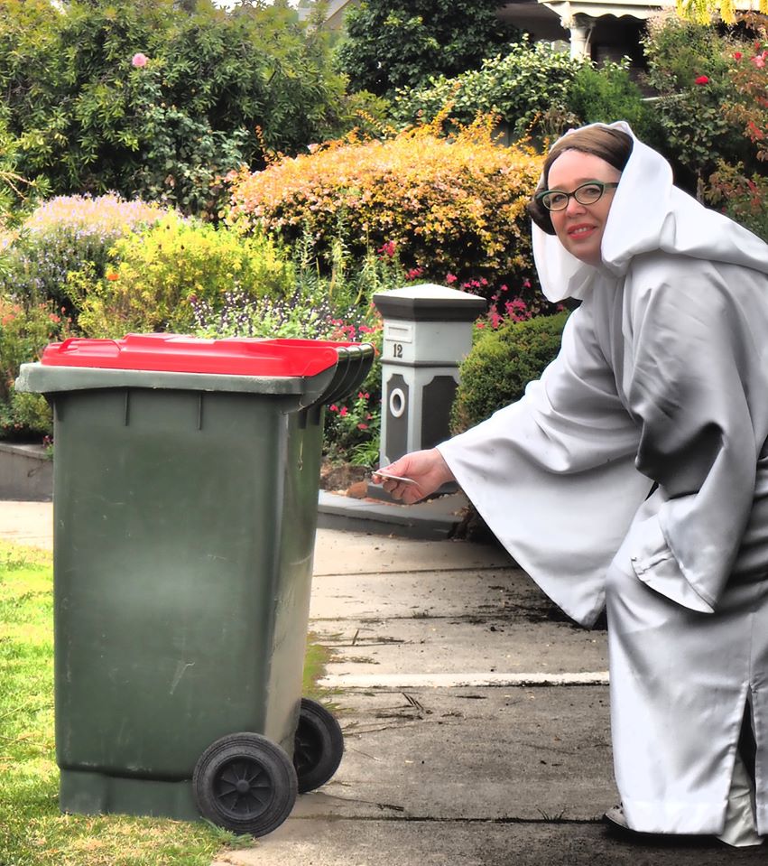 woman dressed as Princess Leia, takes out trash during COVID-19