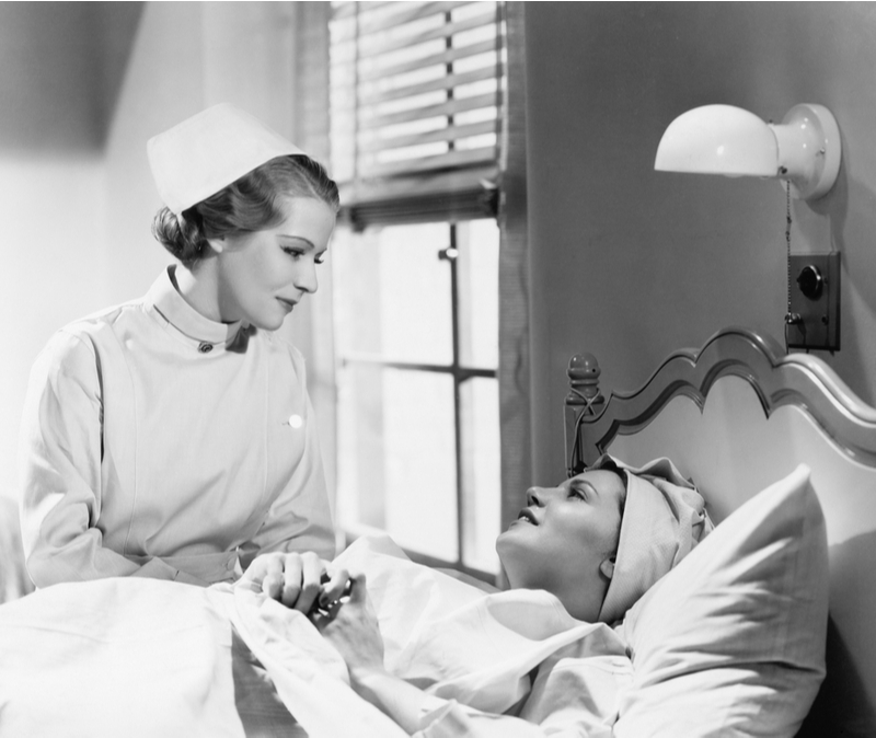 old fashioned nurse comforts patient