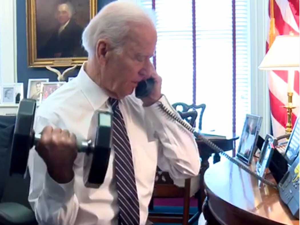 Biden on Phone in Oval Office lifting hand weight